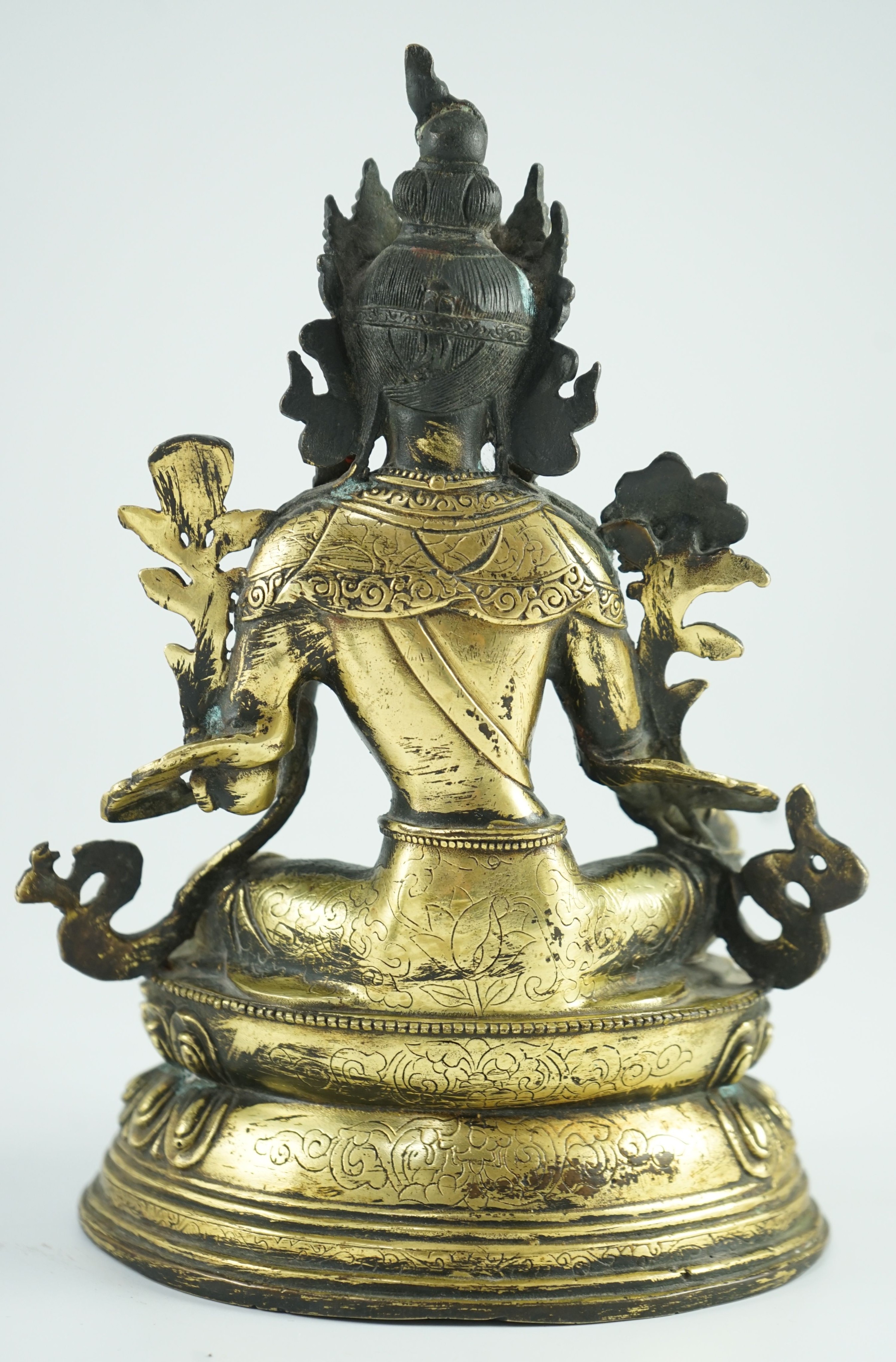 A Sino-Tibetan bronze seated figure of Green Tara, 23.5 cm high